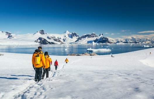 Photo by David Merron Quark passengers hiking on Petermann Island